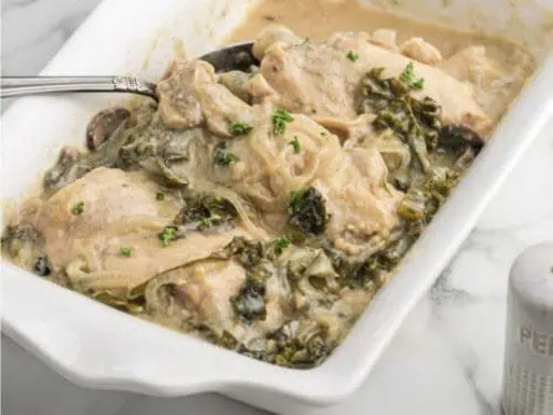 smothered chicken in a baking dish.